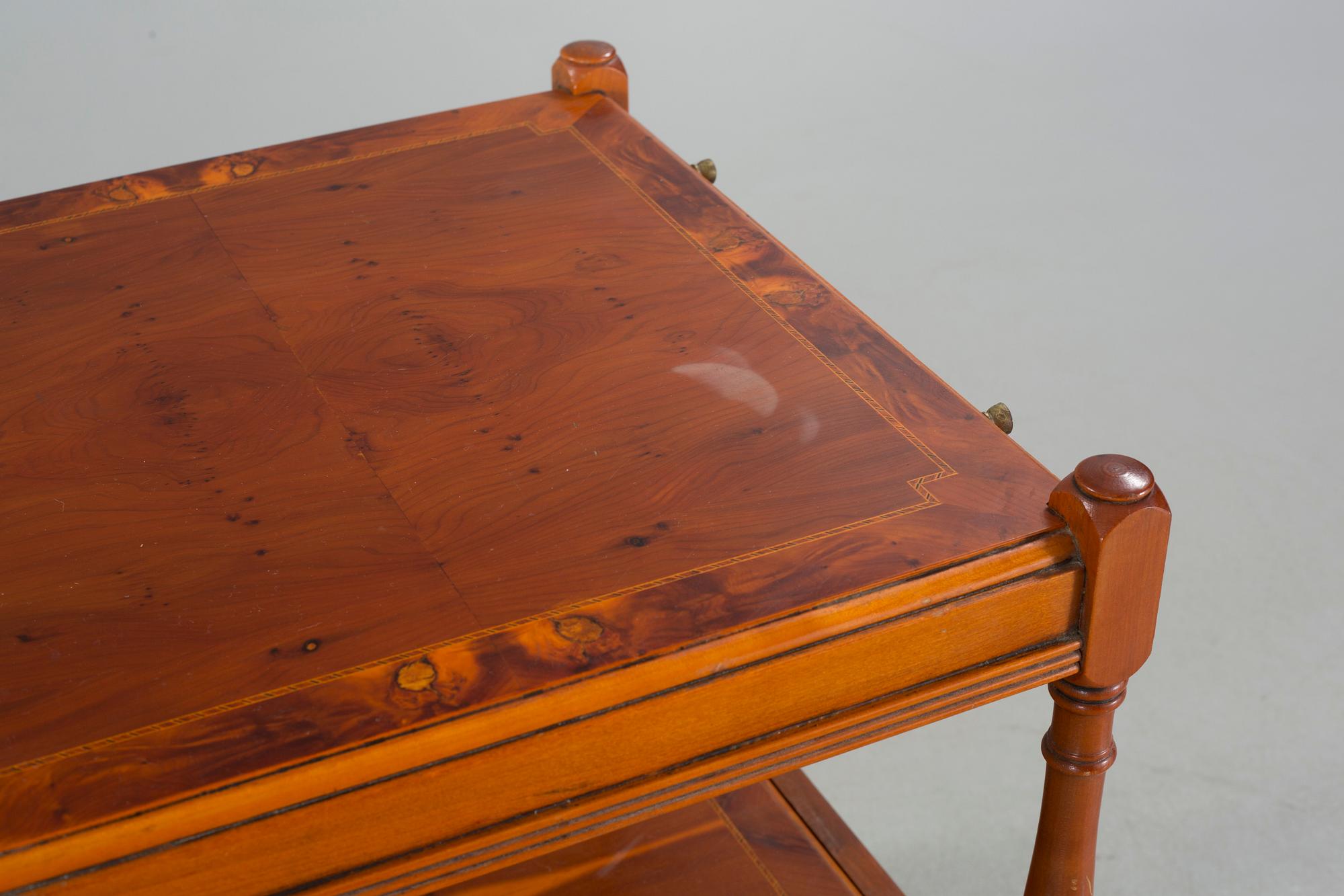 A pair of English style side tables from the second half of the 20th century.