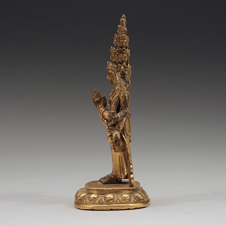 A standing figure of a 11-head Avalokiteshvara with eight arms, Tibet, circa 1800.