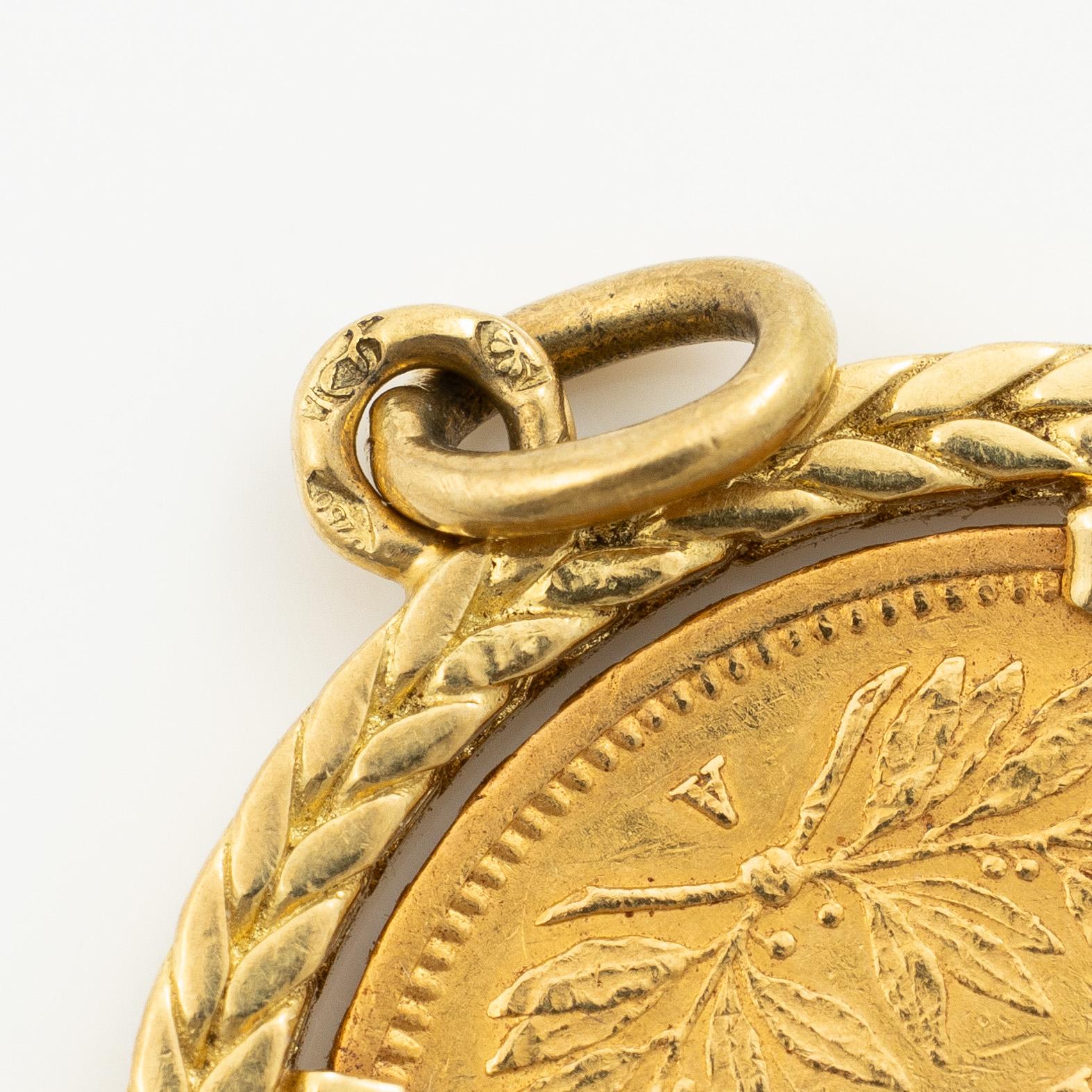 Gold coin, France, Napoleon III, 20 Francs, 1858, set in an 18-carat gold surround.