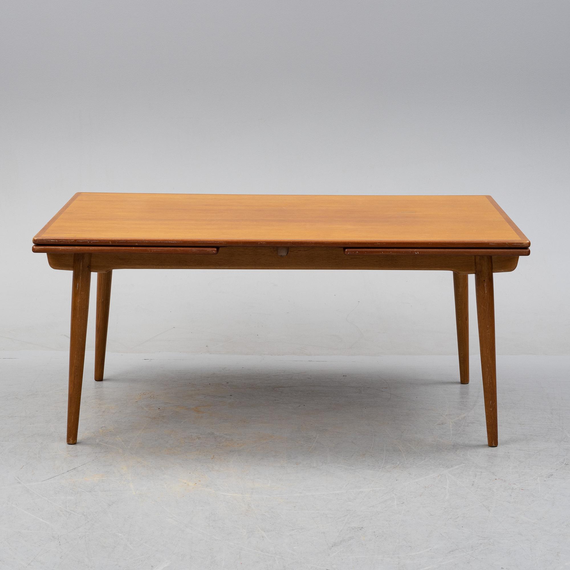Hans J Wegner, a model 'AT-312' teak veneered dining table, Andreas Tuck, Denmark.