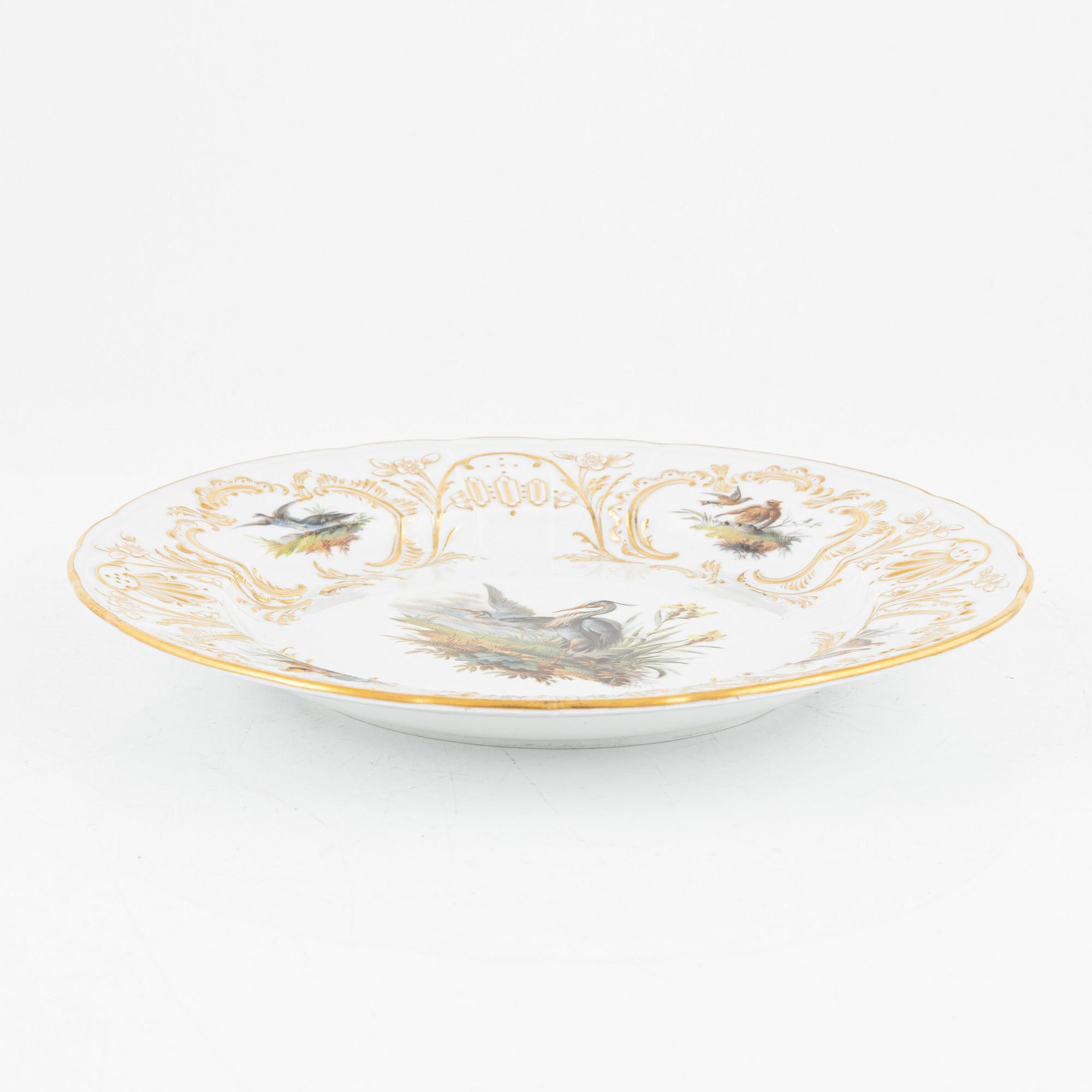 A set of five Meissen porcelain games plates, late 19th to early 20th century.