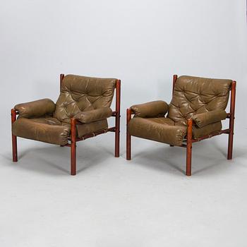 A pair of leather armchairs, 1970s.