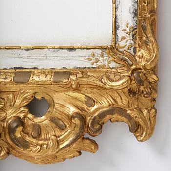 A giltwood rococo mirror, Stockholm, later part 18th century.