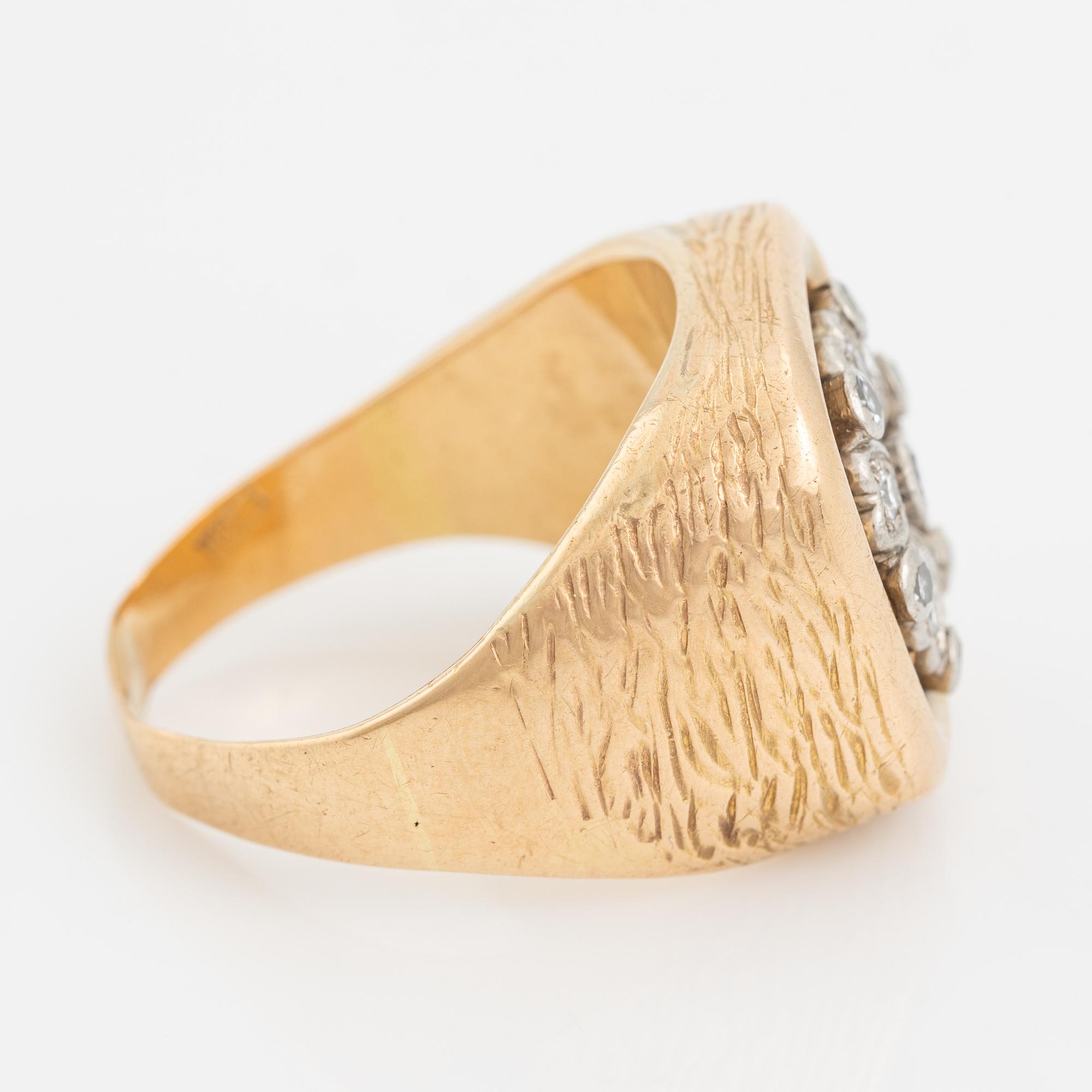 An 18K gold ring set with eight-cut diamonds.