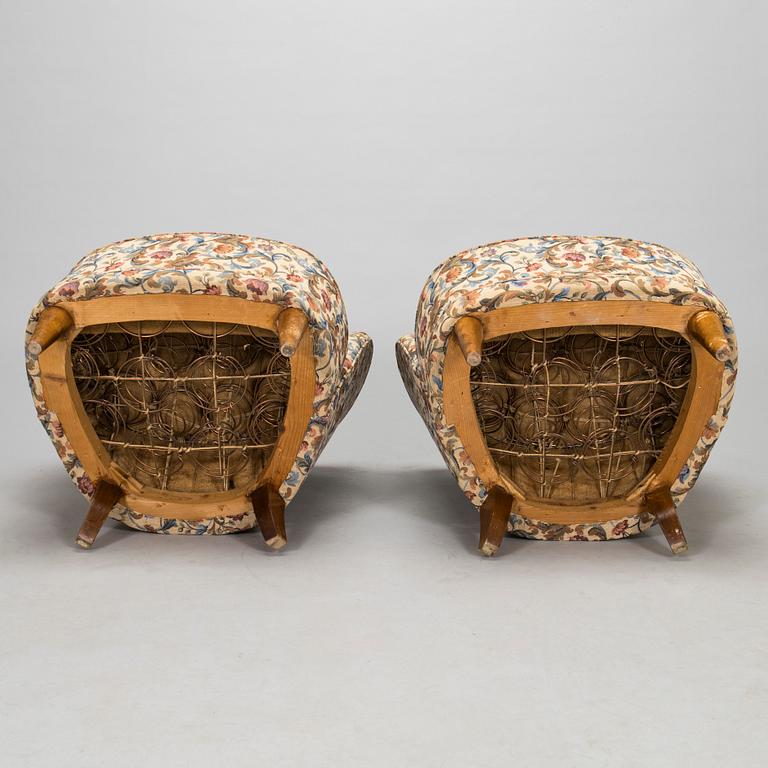 A pair of mid-20th-century armchairs.