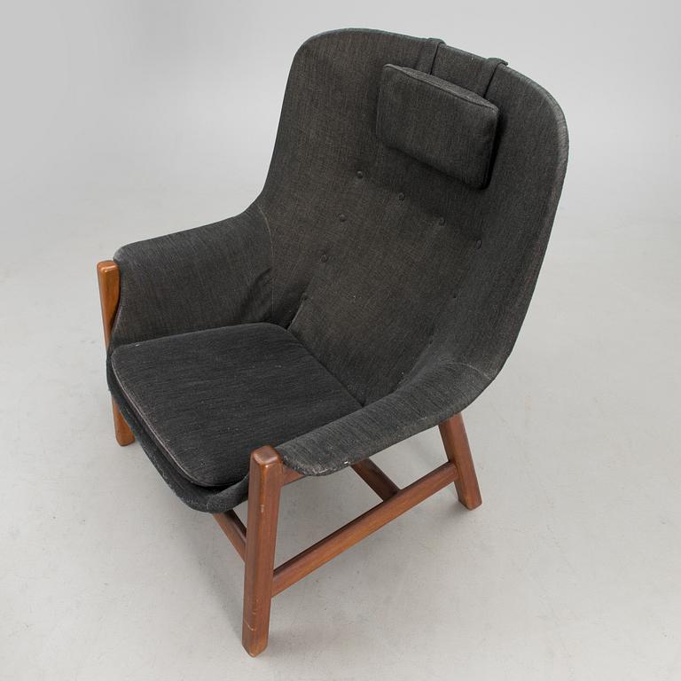 A 1960s 'Caravelle' armchair and ottoman for Puunveisto Oy - Träsnideri Ab, Finland.