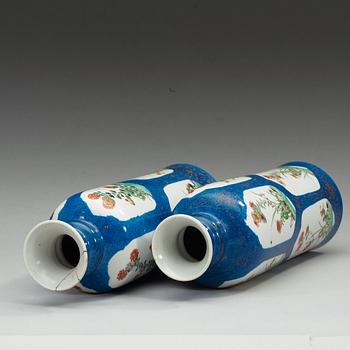A matched pair of powder blue vases with 'famille-verte' enamels, Qing dynasty, Kangxi (1622-1722).