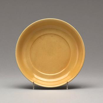 A yellow glazed dish, Ming dynasty, Xuande mark and of the period (1425-35).