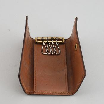 LOUIS VUITTON, a 'Trousse toilette 28' toilet bag and a key case.