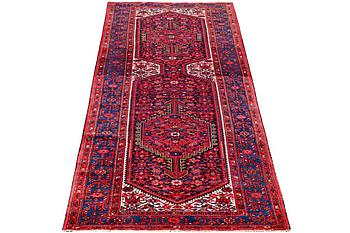 A Hosseinabad runner carpet, c. 391 x 135 cm.