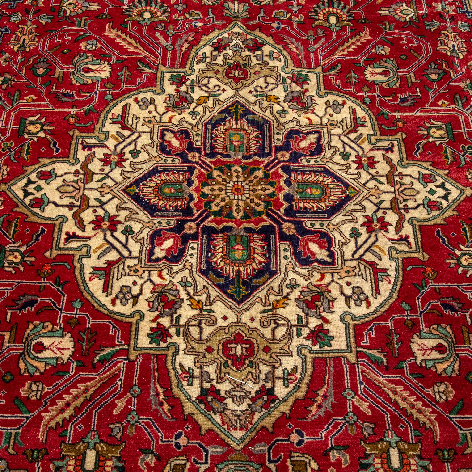 A carpet, Tabriz, ca 345 x 240 cm.