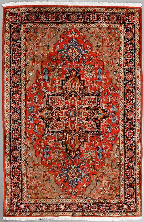 An oriental rug, ca 280 x 195 cm.