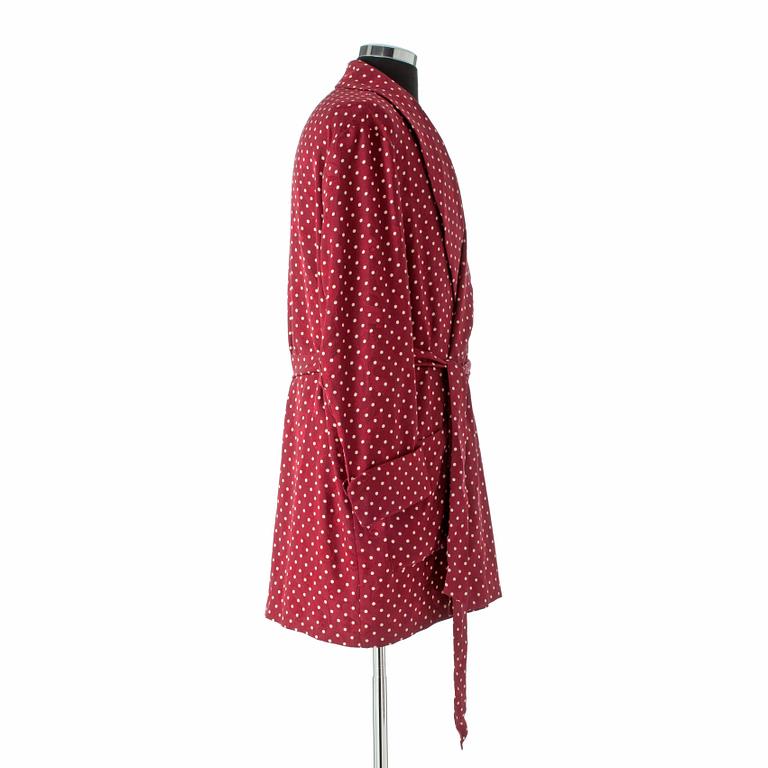 EDSOR KRONEN, a burgundy red and white polka dotted dressing gown.