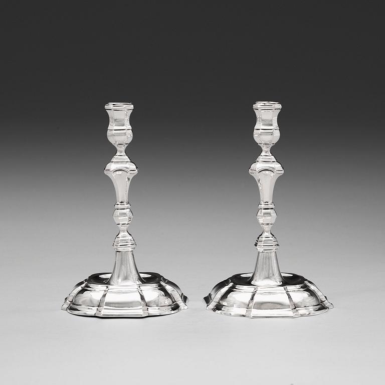 A pair of 18th century silver candlesticks, unidentified makers mark WP.