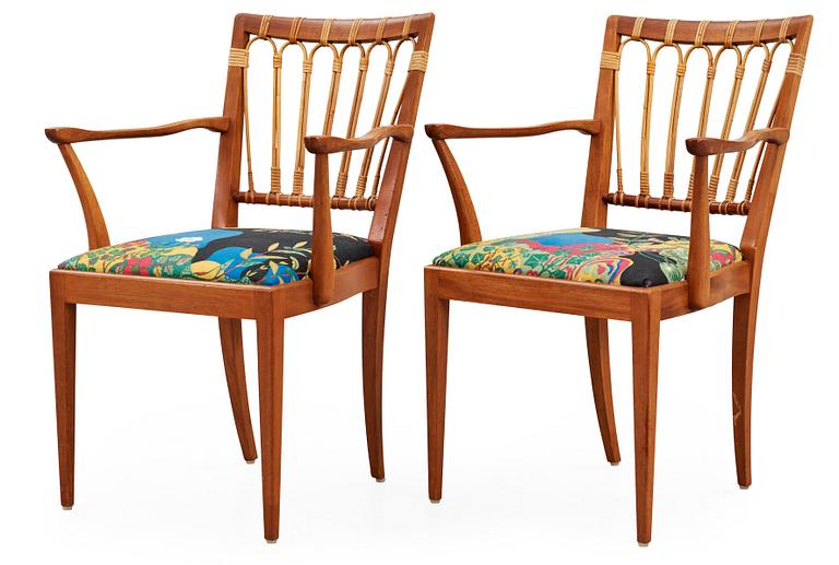 A pair of Josef Frank mahogany and rattan armchairs, Svenskt Tenn, model 1165.