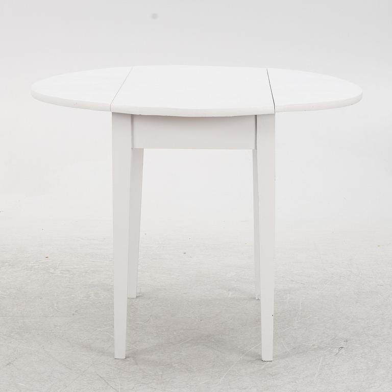 A drop-leaf table, early 20th Century.