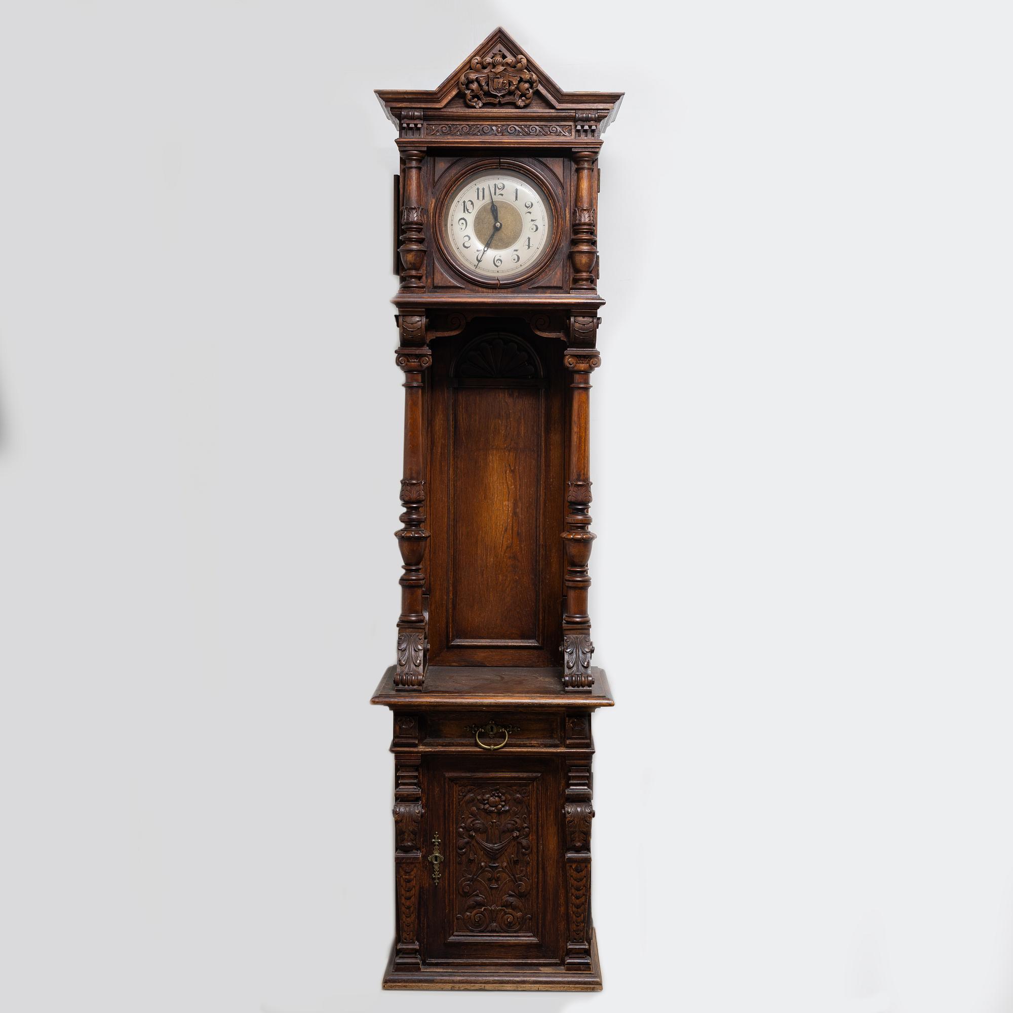 A long-case clock, late 19th century.