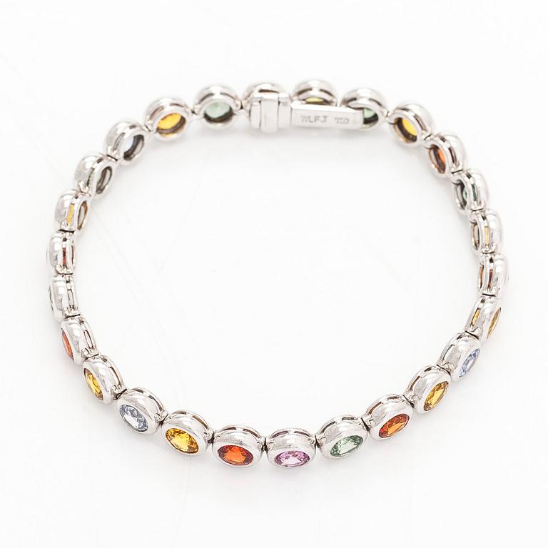 An 18K white gold bracelet, set with multicoloured sapphires.