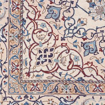 A Nain Habibian rug, part silk. Around 210 x 133 cm.