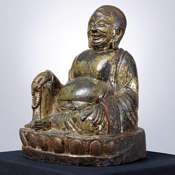 A large seated bronze figure of Budai, Ming Dynasty, dated to the fifth year of Jiajing (1526).