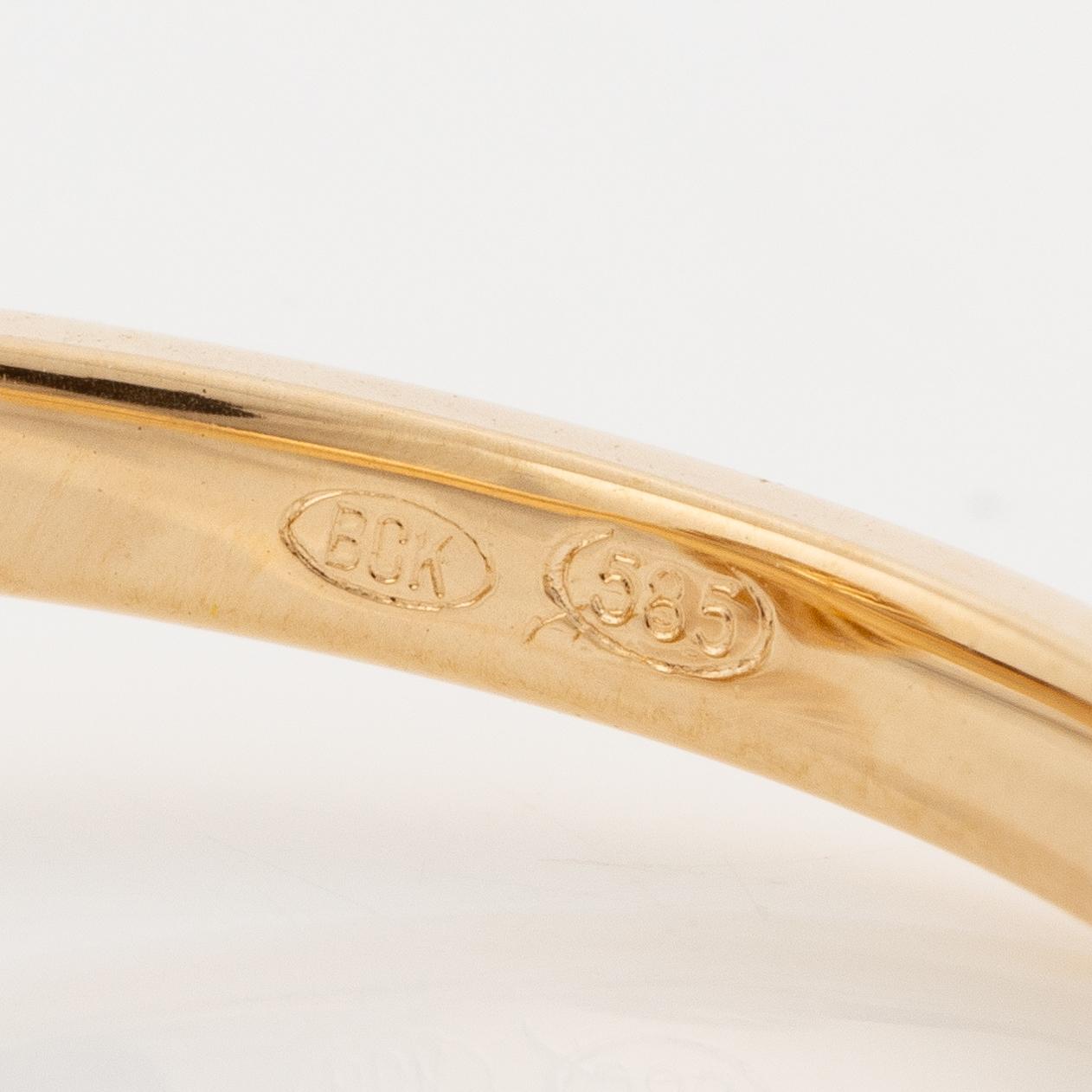 Ring 14K vitguld med orange turmalin och briljantslipade diamanter.