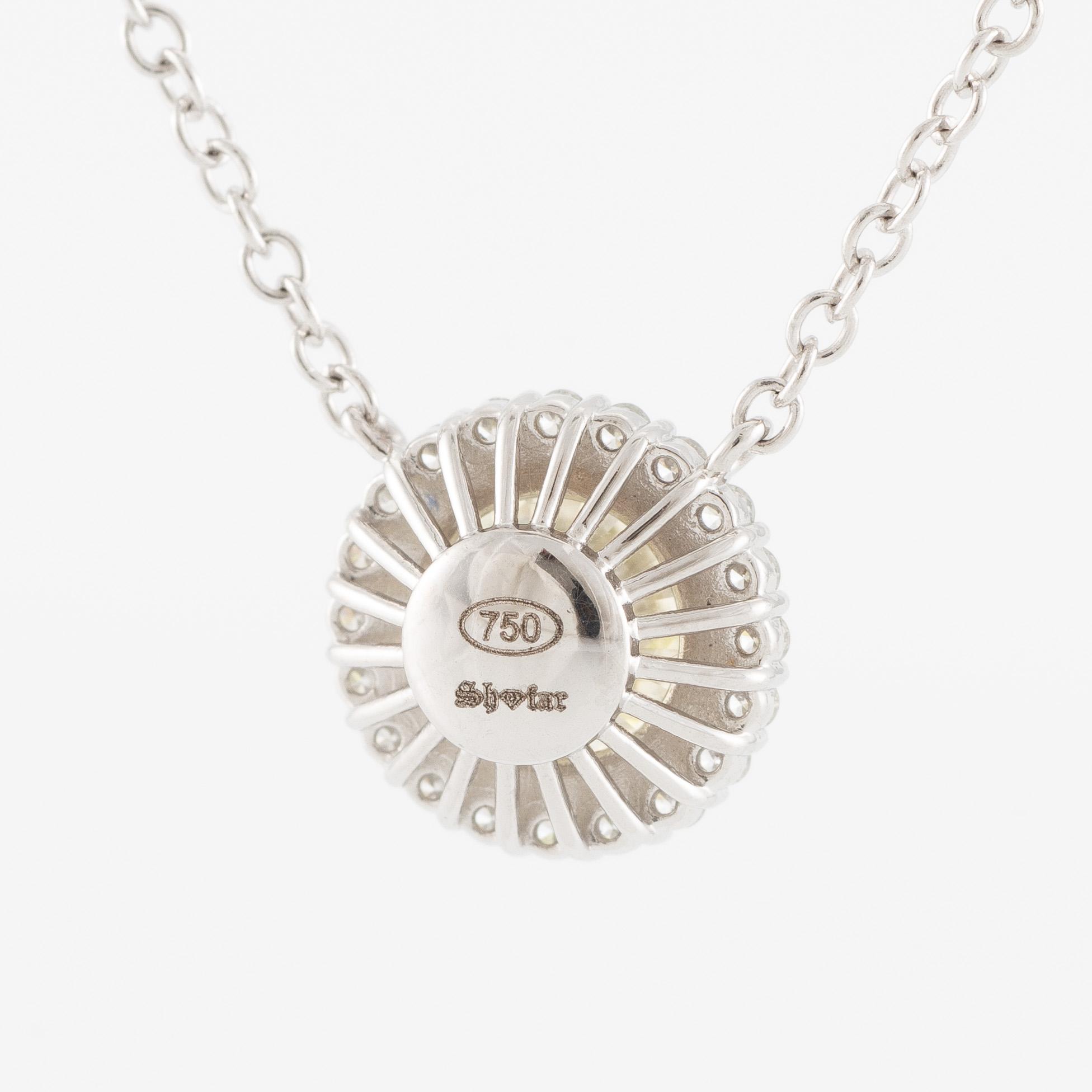 Collier 18K vitguld med briljantslipad diamant.