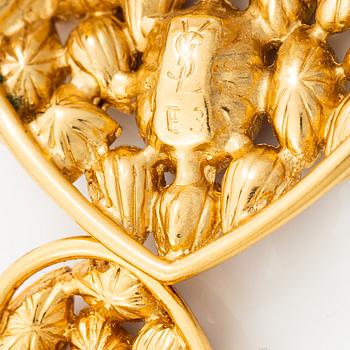 Yves Saint Laurent, earrings and brooch.