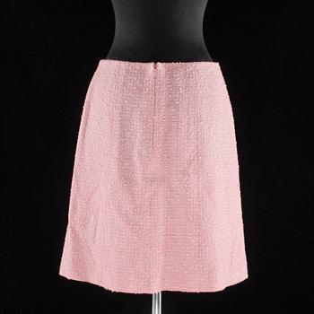 A pink bouclé skirt by Chanel.