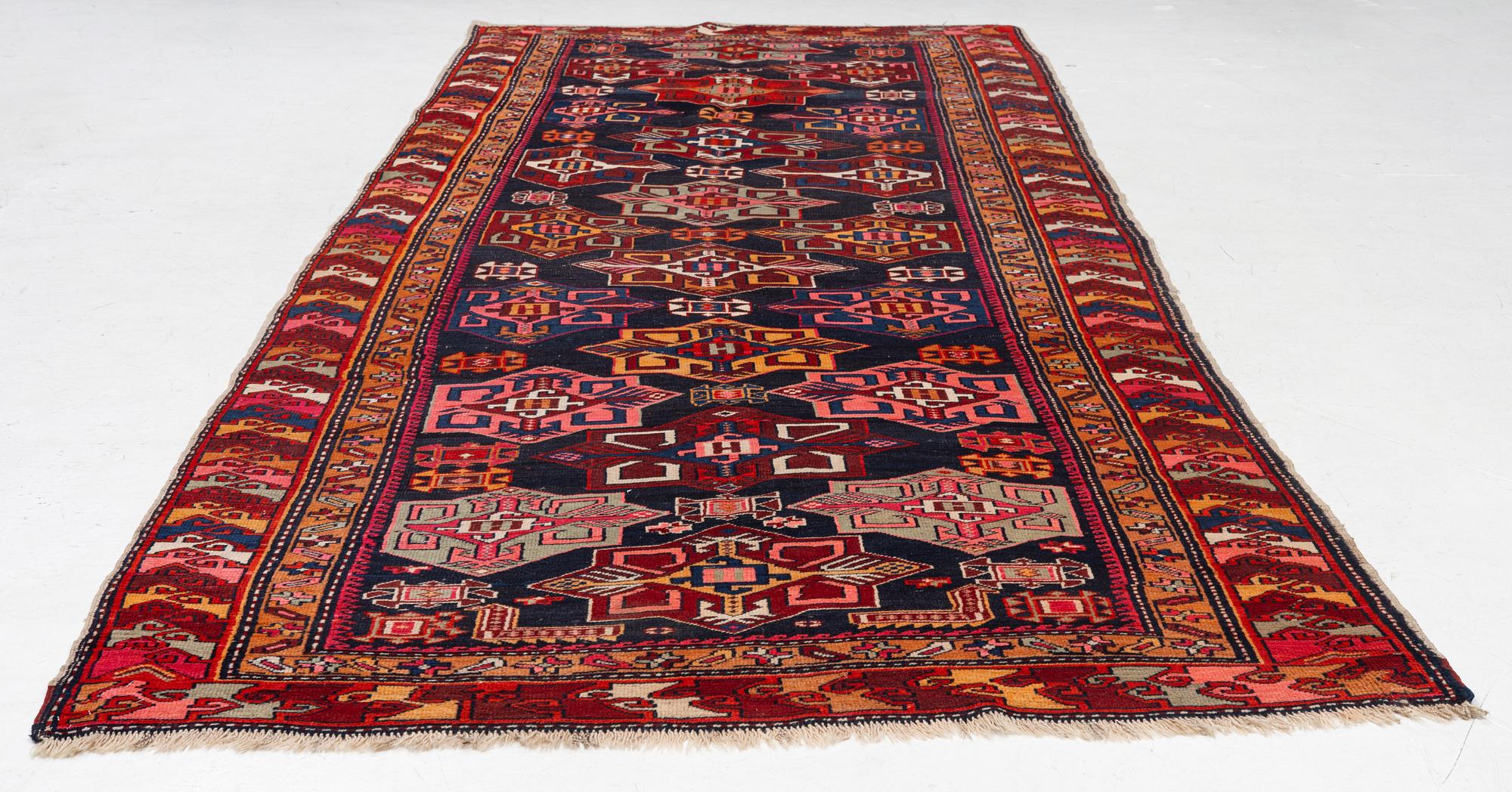 A semi-antique Anatolian runner, c. 409 x 159 cm.