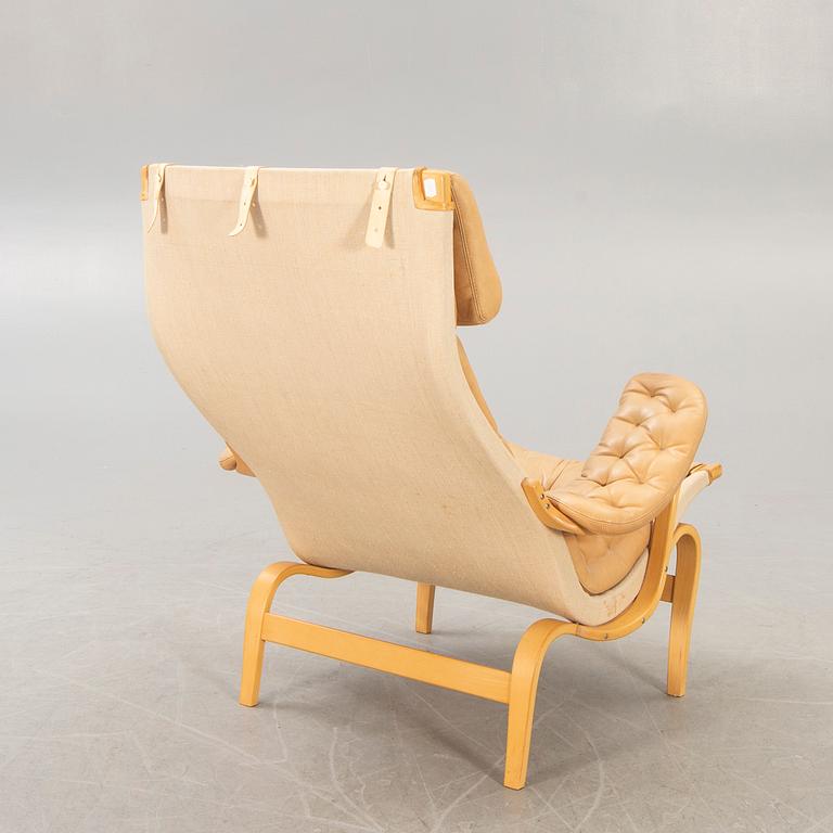 A Bruno Mathsson "Pernilla" leather easy chair for DUX later part of the 20th century.