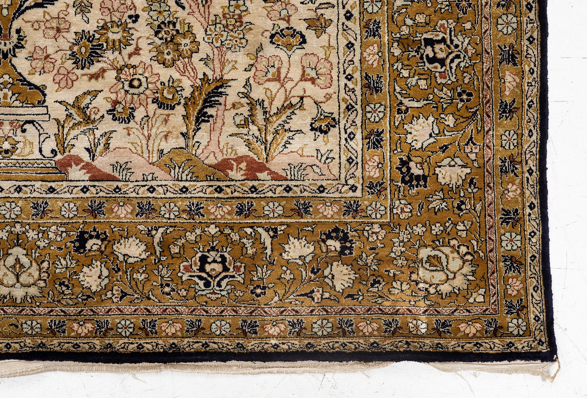 A Ghom, silk rug, c. 215 x 140 cm.
