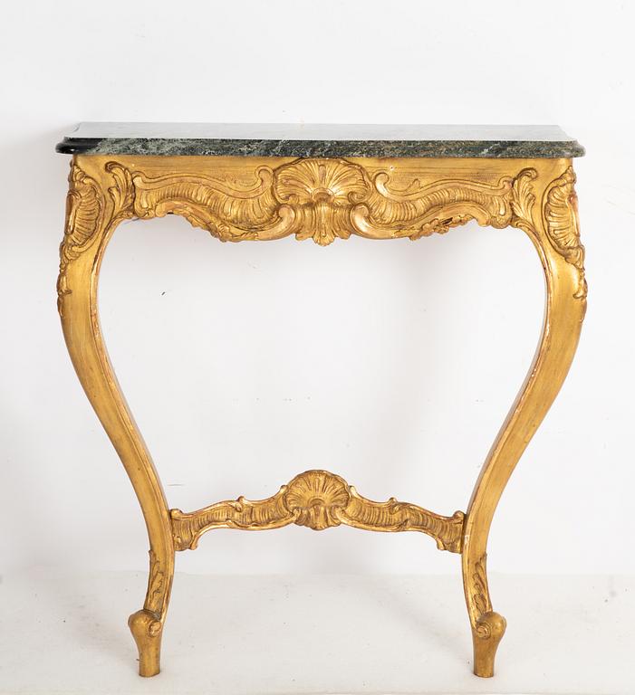 A Rococo style mirror and a console table, first half of the 20th Century.