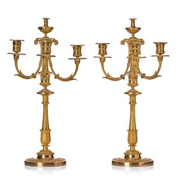 123. A pair of Empire candelabra.