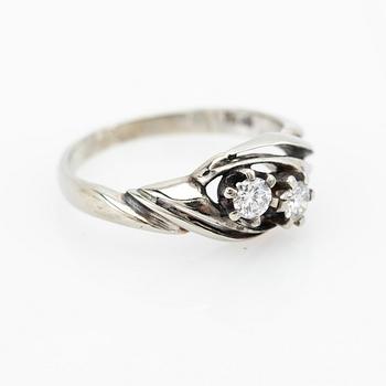 Ring, 18K white gold with two brilliant-cut diamonds.