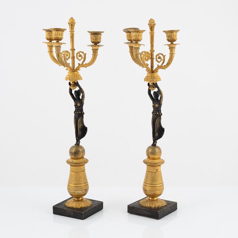 A pair of bronz empire style candelabras, 19th Century.