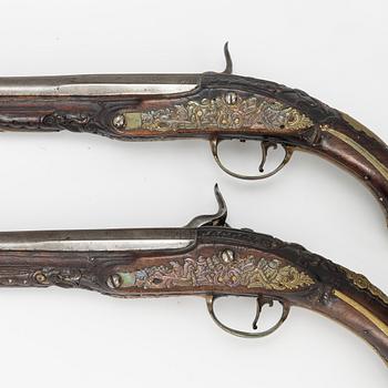 A pair of percussion pistols, converted from flintlock. 18th century.