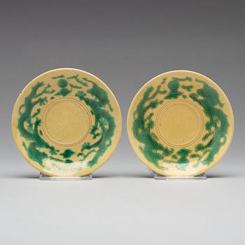 A pair of yellow glazed tea cups with stands, Qing dynasty with Guangxus six character mark (1875-1908).