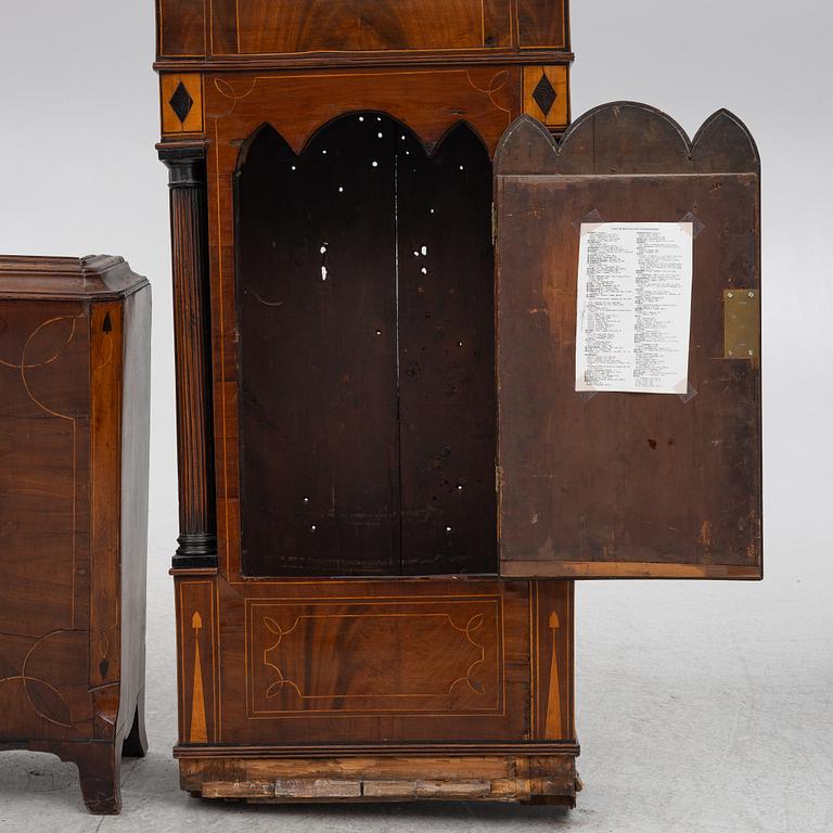 A long-case clock, England, 19th century.
