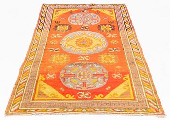 A Carpet, Khotan (?), 217 x 108 cm.
