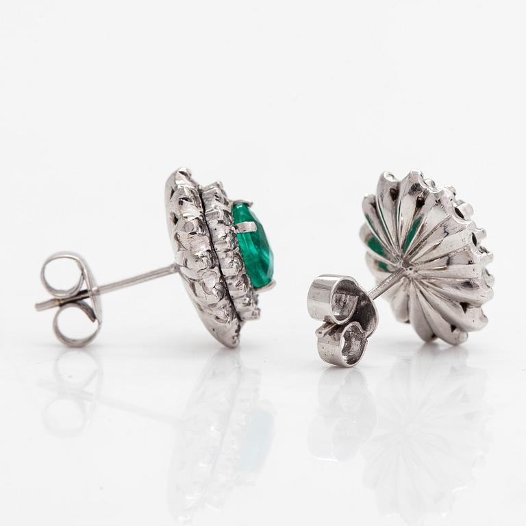 Earrings, 8K white gold with oval faceted emeralds and round brilliant and single-cut diamonds.