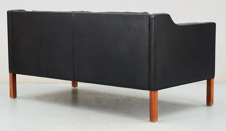 A Børge Mogensen black leather two seated sofa, Fredericia, Denmark.