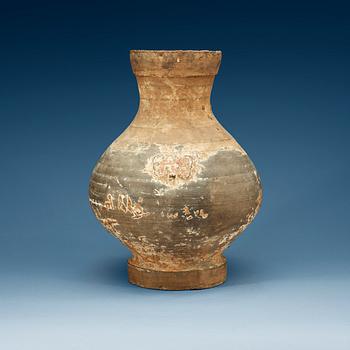 1250. A unglazed jar, Han dynasty, (206 BC - 220 AD).
