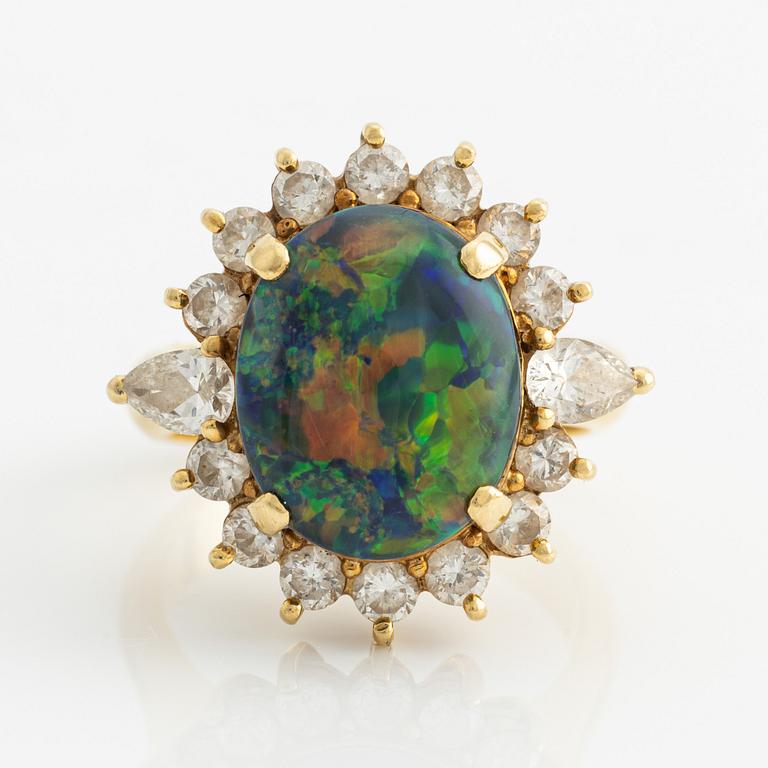 Ring, gold with opal and brilliant and drop-cut diamonds.