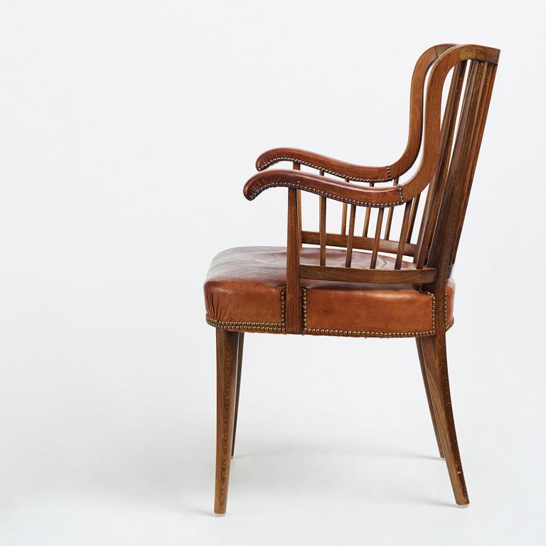 Otto Schulz, a Swedish Modern stained beech and cognac coloured leather armchair.