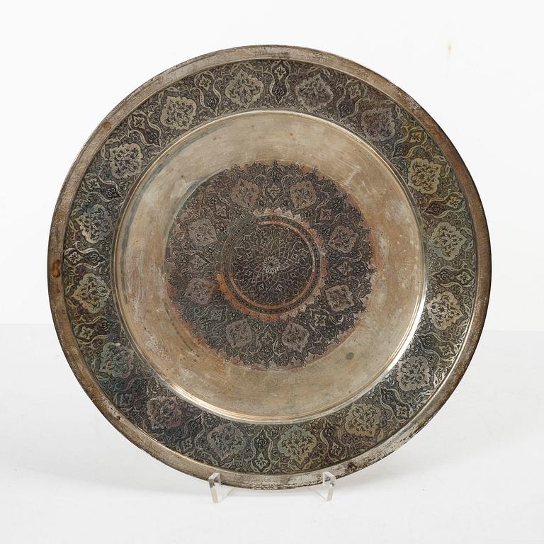 A pair of Persian silver plates, 20th century.