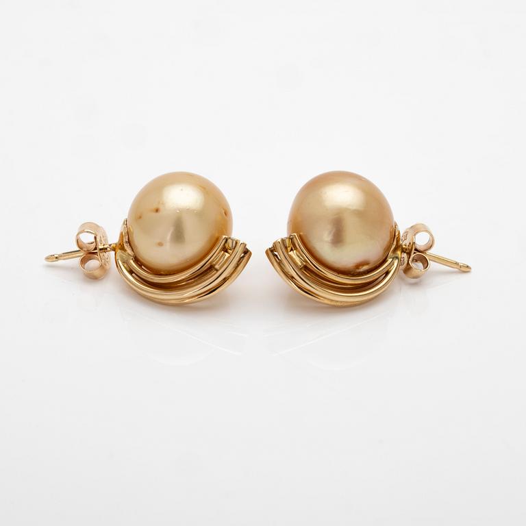18K gold earrings with South Sea pearls and diamonds.