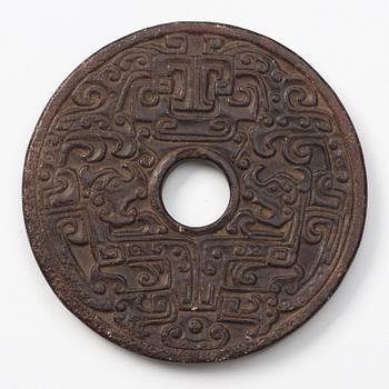 A group of three archaistic Chinese stone bi discs and two pendants.