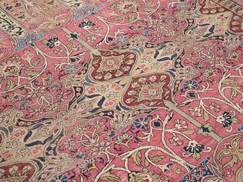 A CARPET, an antique Kerman Laver, ca 363 x 301 cm.