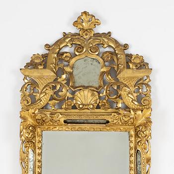 A South German Baroque carved giltwood mirror, early 18th century.