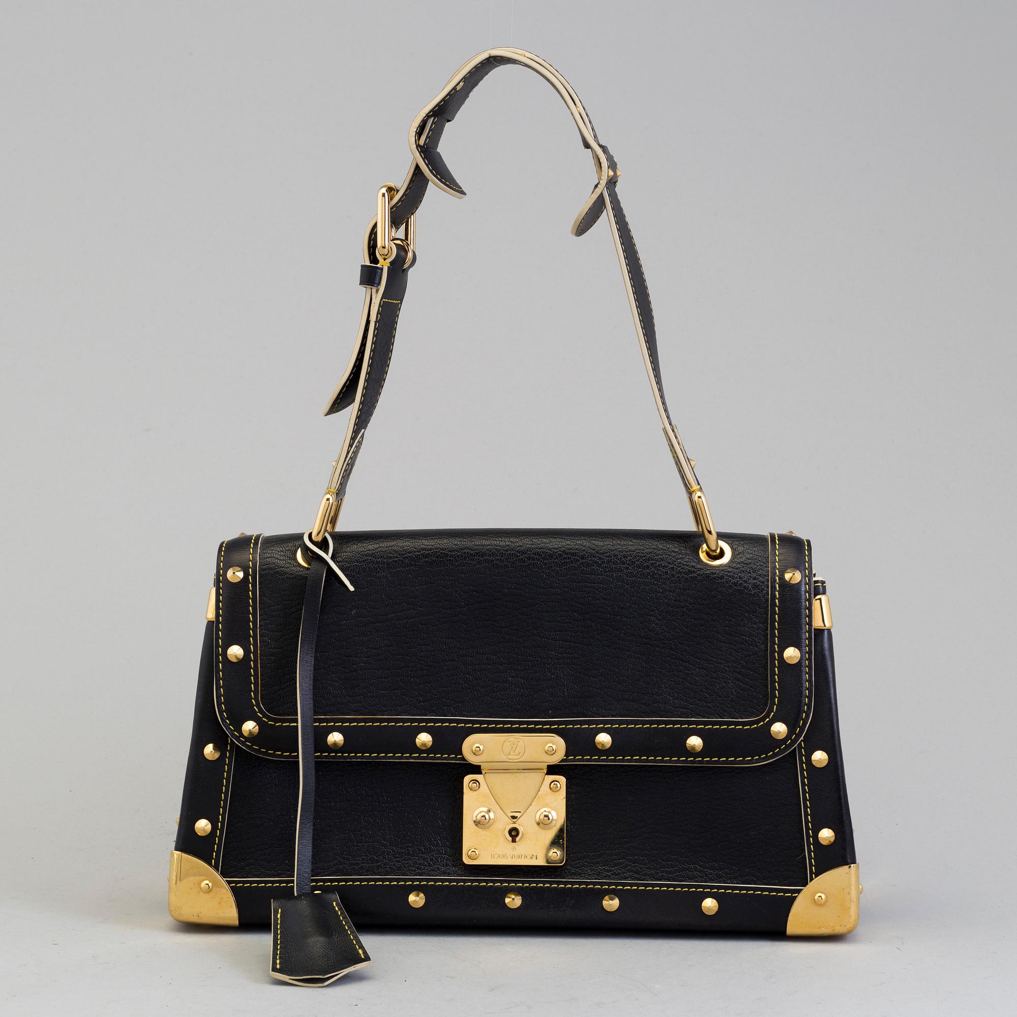 LOUIS VUITTON a studded leather hand bag. Bukowskis